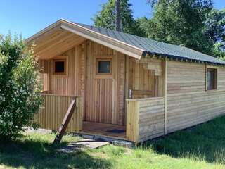 Фото Лоджи Tranquil Log Cabin Retreat in Šventoji г. Швянтойи